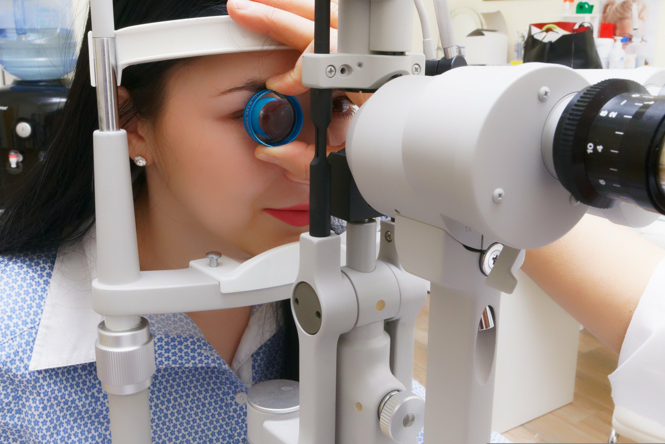 A female doctor carefully examines a young girl's face during a medical checkup.